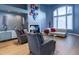 Elegant living room featuring hardwood floors, fireplace, and ample natural light at 98 Glenmoor Ln, Cherry Hills Village, CO 80113