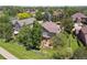 Aerial view of the home's backyard, patio, and surrounding neighborhood at 7311 Brixham Cir, Castle Pines, CO 80108