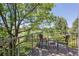 Balcony with chairs overlooking golf course and surrounding foliage at 7311 Brixham Cir, Castle Pines, CO 80108