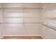 Spacious closet with multiple rows of metal shelving and wooden floor at 7311 Brixham Cir, Castle Pines, CO 80108