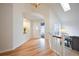 Bright foyer with hardwood floors, vaulted ceilings, and decorative niche at 7311 Brixham Cir, Castle Pines, CO 80108