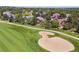 An aerial view looking at the golf course and surrounding homes at 7311 Brixham Cir, Castle Pines, CO 80108