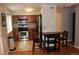 Efficient kitchen with stainless steel appliances, ample cabinetry, and adjacent dining area at 1421 N Pearl St # 2, Denver, CO 80203