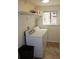 Functional laundry room with washer, dryer, shelving, and natural light at 1421 N Pearl St # 2, Denver, CO 80203