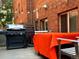 Cozy patio with string lights, grill, and outdoor seating for relaxing and entertaining at 1421 N Pearl St # 2, Denver, CO 80203