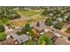This is an aerial view of a home with a wooden deck and a well-maintained lawn near green spaces at 10859 W Fair Ave, Littleton, CO 80127