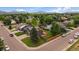 Aerial view featuring a well-kept front lawn, fenced backyard, and a cozy deck with mountain views at 10859 W Fair Ave, Littleton, CO 80127