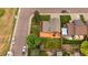 Aerial view of home highlighting backyard with orange deck and well-maintained lawn at 10859 W Fair Ave, Littleton, CO 80127