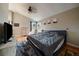 Cozy bedroom with vaulted ceiling, ceiling fan and hardwood floors at 10859 W Fair Ave, Littleton, CO 80127