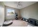 Bedroom featuring a window with pet bed at 10859 W Fair Ave, Littleton, CO 80127
