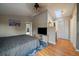 Bright bedroom featuring a skylight and wood floors at 10859 W Fair Ave, Littleton, CO 80127