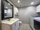 Laundry area features a vanity and toilet for added convenience at 10859 W Fair Ave, Littleton, CO 80127