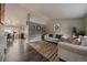 Cozy living room features neutral paint, hardwood floors, and comfortable seating perfect for relaxation at 10859 W Fair Ave, Littleton, CO 80127
