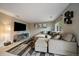Bright living room with a large sectional sofa and modern decor at 10859 W Fair Ave, Littleton, CO 80127
