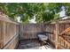 Backyard with tall wood fence and gate at 7970 Chase Cir # 85, Arvada, CO 80003