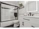 Modern bathroom with white subway tile and black trim, featuring a shower and vanity at 7970 Chase Cir # 85, Arvada, CO 80003