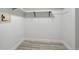 Empty white closet with shelving and light-colored wood floors at 7970 Chase Cir # 85, Arvada, CO 80003