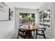 Cozy dining area with natural light, a round wooden table, and comfortable seating for enjoyable meals at 7970 Chase Cir # 85, Arvada, CO 80003