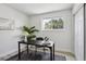 Office space featuring bright light, neutral walls, and wood laminate floors at 7970 Chase Cir # 85, Arvada, CO 80003