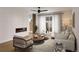 Elegant living room featuring a modern fireplace, hardwood floors, and chic neutral furnishings at 2281 S Sherman St, Denver, CO 80210