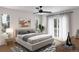 Serene bedroom with natural light, a modern ceiling fan, and a private balcony access at 2281 S Sherman St, Denver, CO 80210