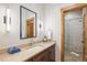 Modern bathroom featuring a large mirror, spacious vanity, and a walk-in shower at 41 Barton Ridge Dr, Breckenridge, CO 80424