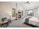 Cozy bedroom featuring a fireplace, large windows and a seating area for relaxation at 41 Barton Ridge Dr, Breckenridge, CO 80424