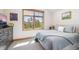Bright bedroom with large window, neutral tones, and plush carpet at 41 Barton Ridge Dr, Breckenridge, CO 80424