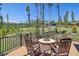 Scenic deck with rocking chairs surrounding stone fire pit, overlooking mountain views at 41 Barton Ridge Dr, Breckenridge, CO 80424