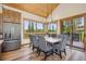 Bright dining room featuring wood floors, table with seating, and large windows with views at 41 Barton Ridge Dr, Breckenridge, CO 80424