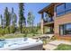 Outdoor hot tub with views of mature trees and mountains at 41 Barton Ridge Dr, Breckenridge, CO 80424