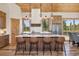 Stylish kitchen with wooden island, sleek countertops, and modern lighting at 41 Barton Ridge Dr, Breckenridge, CO 80424