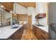 Spacious kitchen with wood cabinets, a large island, and stainless steel appliances at 41 Barton Ridge Dr, Breckenridge, CO 80424