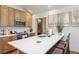 Kitchen features a spacious island with seating, stainless steel appliances and lots of cabinets at 41 Barton Ridge Dr, Breckenridge, CO 80424
