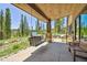 Covered patio featuring porch swing, bench seating and views of nature at 41 Barton Ridge Dr, Breckenridge, CO 80424