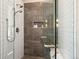 Modern shower with tile surround and various shower heads at 41 Barton Ridge Dr, Breckenridge, CO 80424