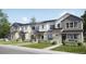 Attractive row of townhomes displaying modern design elements and beautiful exteriors at 6688 E 149Th Ave # 5, Thornton, CO 80602