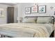 Large main bedroom with a king-size bed and plenty of natural light at 12233 W Cross Dr # 204, Littleton, CO 80127