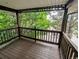 A cozy wooden balcony with views of lush greenery and trees at 17361 E Mansfield Ave # 532R, Aurora, CO 80013