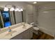 Bright bathroom featuring a double sink vanity and shower/tub combo at 17361 E Mansfield Ave # 532R, Aurora, CO 80013