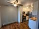 Bright kitchen with stainless steel appliances, white cabinets, and breakfast nook at 17361 E Mansfield Ave # 532R, Aurora, CO 80013