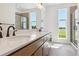 Bathroom with a double sink vanity, quartz countertops, and a separate glass shower at 11481 E Briarwood Cir, Centennial, CO 80112