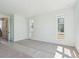 Bright bedroom with carpet flooring and natural light from two picture windows at 11481 E Briarwood Cir, Centennial, CO 80112