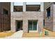 New construction featuring modern brick facade, sizable windows, and second story balconies at 11481 E Briarwood Cir, Centennial, CO 80112