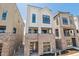 Modern townhome features brick base, ample windows, and inviting curb appeal at 11481 E Briarwood Cir, Centennial, CO 80112