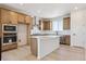 Beautiful kitchen with stainless steel appliances, large island, and wooden cabinetry at 11481 E Briarwood Cir, Centennial, CO 80112