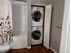 Bathroom features stacked washer/dryer next to shower/tub at 1555 California St # 302, Denver, CO 80202