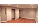 Spacious bedroom showcases hardwood floors and large closet with sliding doors at 1555 California St # 302, Denver, CO 80202