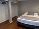 Bedroom featuring a closet, hardwood floors and neutral colors at 1555 California St # 302, Denver, CO 80202