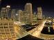 Night view of the Denver city skyline with illuminated buildings and streets at 1555 California St # 302, Denver, CO 80202